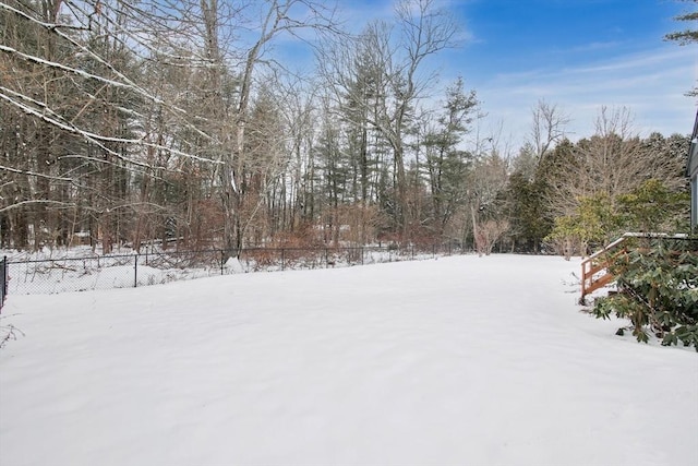 view of yard layered in snow