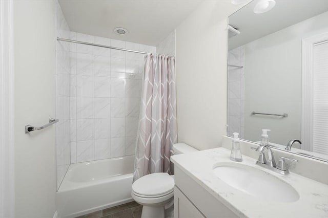 full bath featuring toilet, shower / bath combo with shower curtain, and vanity