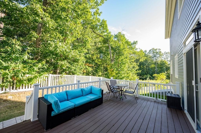 wooden deck featuring outdoor lounge area