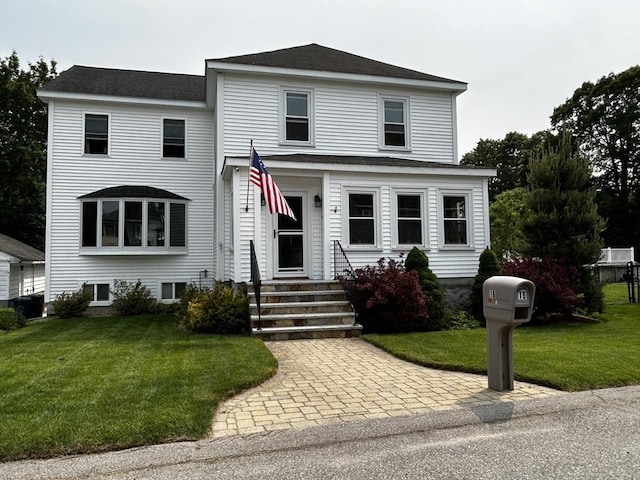 16 Pinehurst Ave, Dracut, MA 01826 - view of front of house featuring a front lawn, entry steps, and roof with shingles