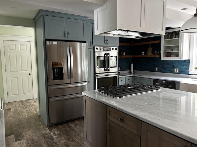 16 Pinehurst Ave, Dracut, MA 01826 - kitchen featuring appliances with stainless steel finishes, dark wood-style flooring, open shelves, backsplash, and light stone counters