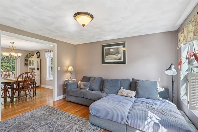 3 Trophy Ave, Townsend, MA 01469 - living room with a chandelier, wood finished floors, and baseboards