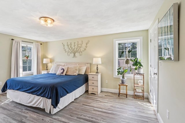 3 Trophy Ave, Townsend, MA 01469 - bedroom with wood finished floors, multiple windows, and baseboards