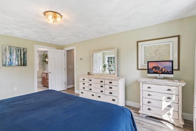 3 Trophy Ave, Townsend, MA 01469 - bedroom with light wood-style flooring, baseboards, and connected bathroom