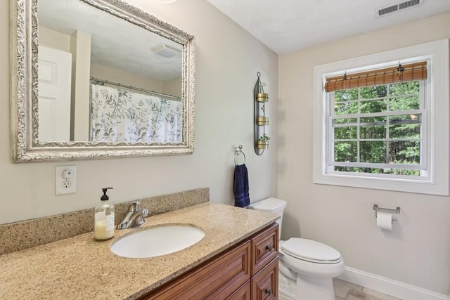 3 Trophy Ave, Townsend, MA 01469 - full bath with vanity, toilet, baseboards, and tile patterned flooring