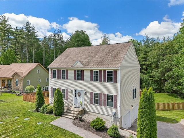 3 Trophy Ave, Townsend, MA 01469 - colonial house featuring an attached garage, asphalt driveway, and roof with shingles