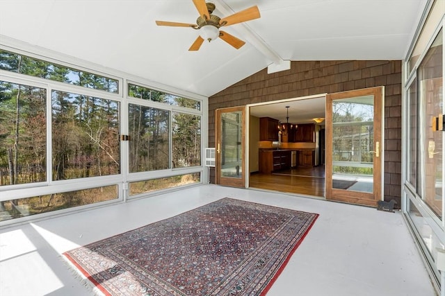 unfurnished sunroom with beamed ceiling and ceiling fan with notable chandelier