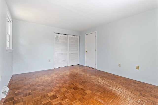 unfurnished bedroom featuring a closet and visible vents