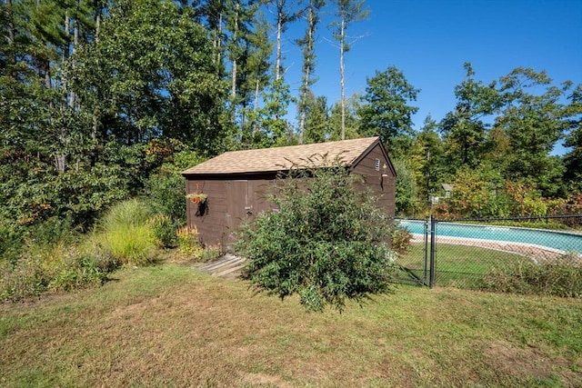view of shed featuring fence