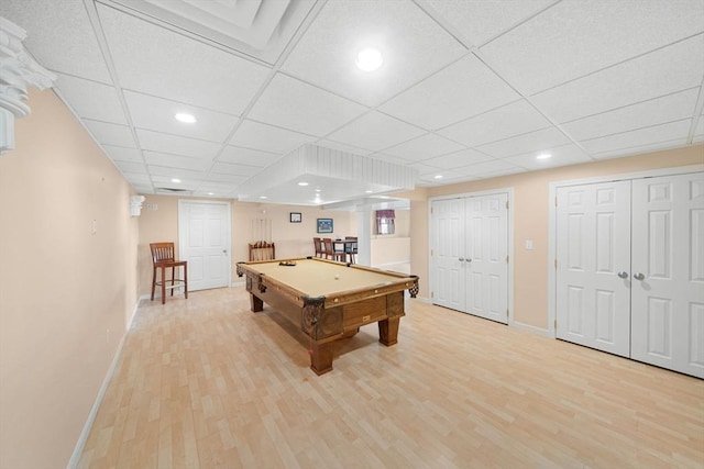 recreation room featuring a paneled ceiling, light wood-style floors, baseboards, and pool table