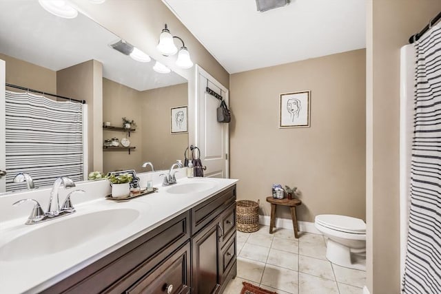 40 Winchester Ln Unit 10, Fall River, MA 02721 - bathroom with double vanity, toilet, tile patterned flooring, a shower with shower curtain, and baseboards