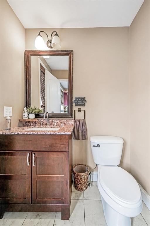 40 Winchester Ln Unit 10, Fall River, MA 02721 - half bath with toilet, vanity, and baseboards