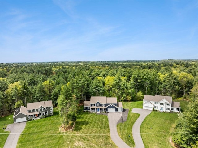 view of subject property featuring a heavily wooded area