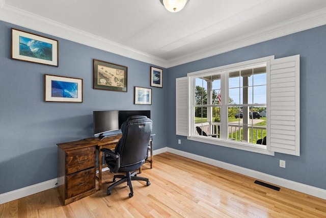 office featuring baseboards, crown molding, and wood finished floors