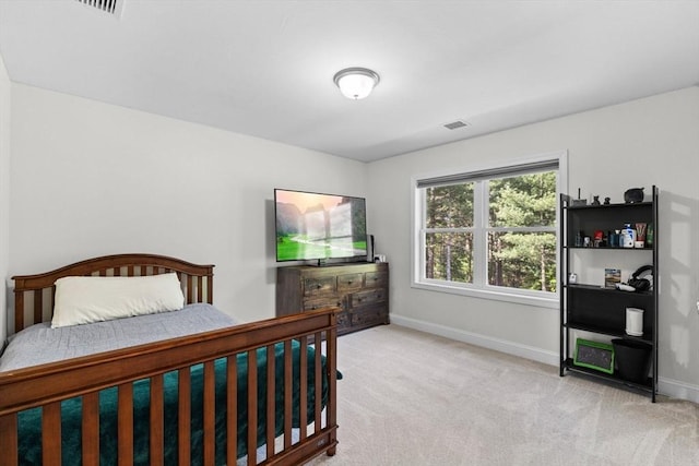 carpeted bedroom with baseboards