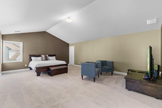 carpeted bedroom featuring lofted ceiling and baseboards
