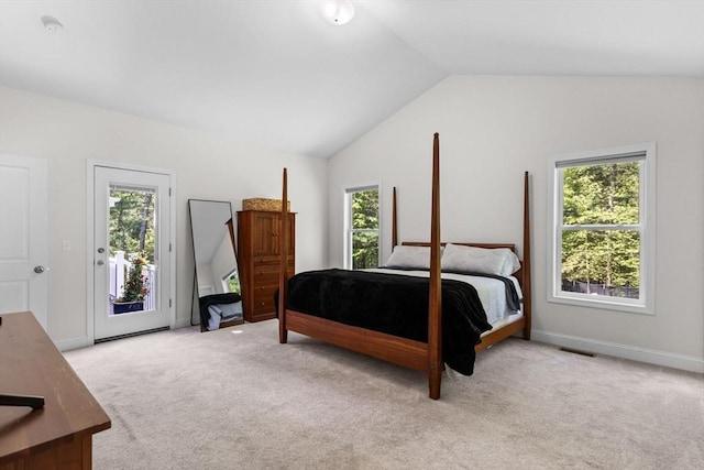 bedroom with access to exterior, vaulted ceiling, light colored carpet, and baseboards