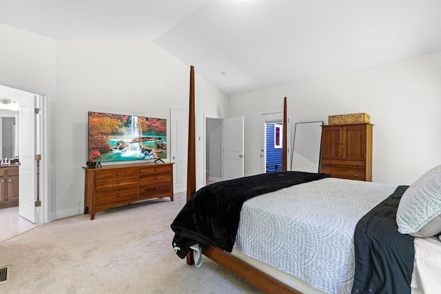 bedroom featuring light carpet, high vaulted ceiling, ensuite bathroom, and baseboards