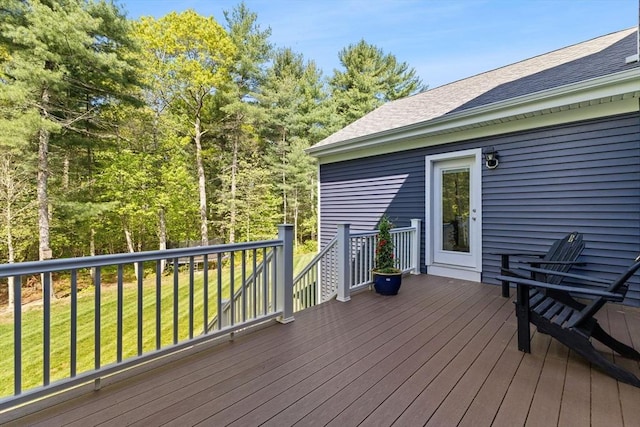 wooden deck with a yard