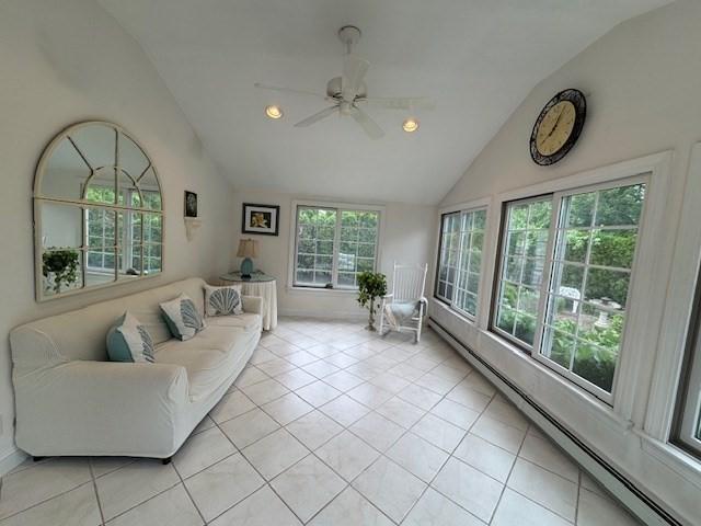18 Lily Pond Dr, Yarmouth, MA 02664 - living room featuring vaulted ceiling, baseboard heating, ceiling fan, light tile patterned floors, and recessed lighting