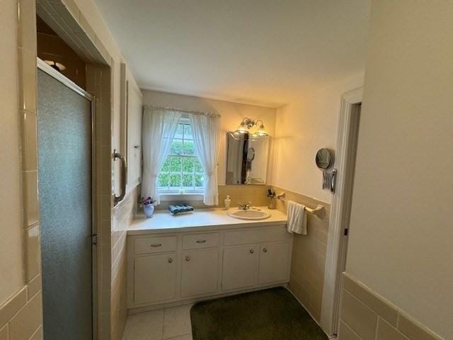 18 Lily Pond Dr, Yarmouth, MA 02664 - full bath with vanity, a stall shower, and a wainscoted wall