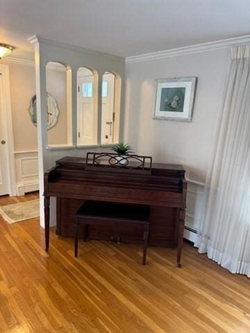 18 Lily Pond Dr, Yarmouth, MA 02664 - sitting room with crown molding, light wood finished floors, and a wainscoted wall