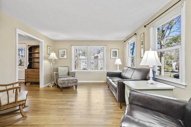 living room with light wood-style floors and baseboards