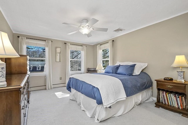 bedroom featuring carpet floors, a ceiling fan, baseboards, visible vents, and crown molding