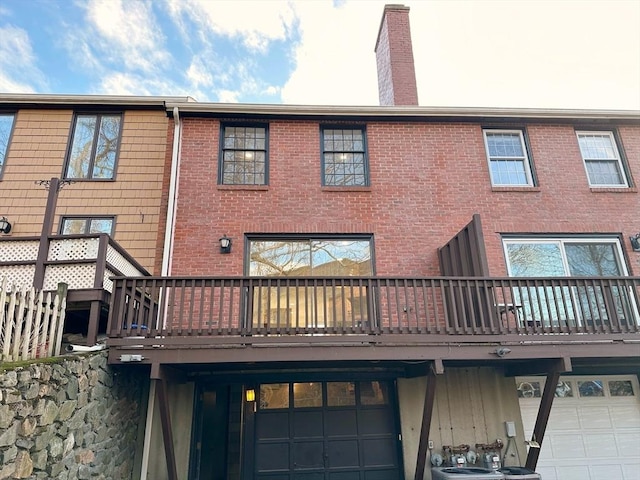 back of house featuring a wooden deck