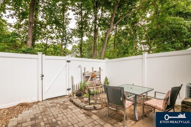 199 Lake St Unit 26, Weymouth, MA 02189 - view of patio featuring a gate and outdoor dining space
