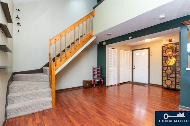 199 Lake St Unit 26, Weymouth, MA 02189 - foyer entrance with wood finished floors, stairway, and a towering ceiling