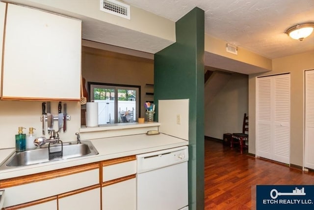 199 Lake St Unit 26, Weymouth, MA 02189 - kitchen with dishwasher, light countertops, white cabinetry, dark wood-type flooring, and a textured ceiling