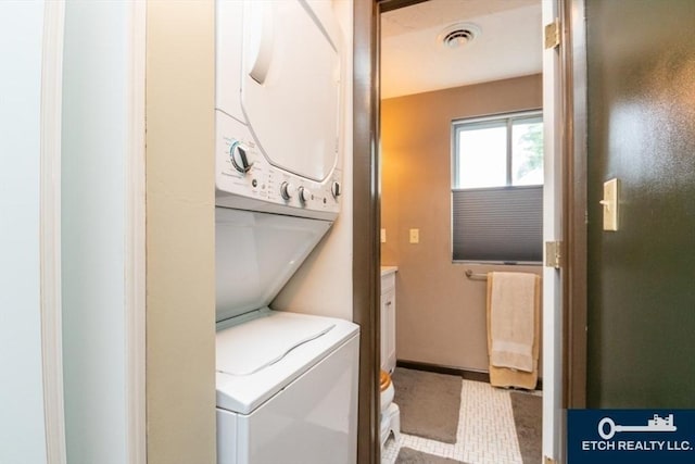 199 Lake St Unit 26, Weymouth, MA 02189 - laundry room featuring stacked washer / dryer