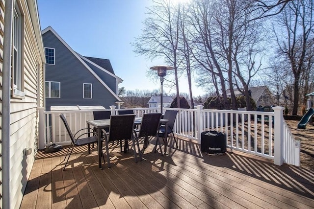 wooden terrace with outdoor dining space