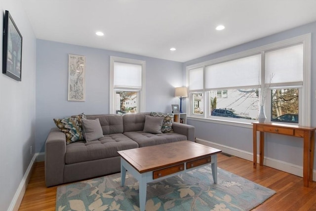 living room with recessed lighting, wood finished floors, and baseboards