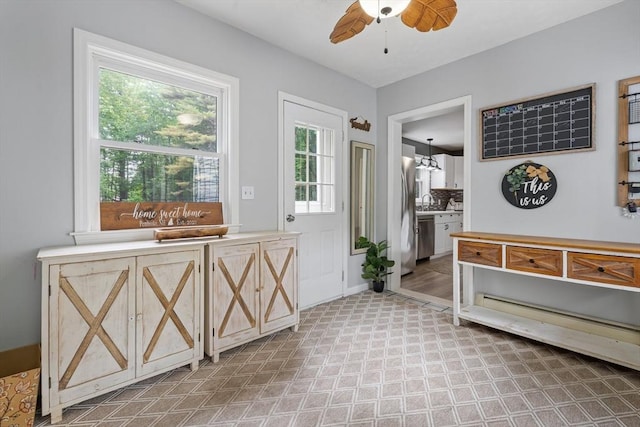 224 Church, Pembroke, NH 03275 - entrance foyer with a ceiling fan and a chandelier