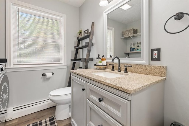 224 Church, Pembroke, NH 03275 - half bathroom with a baseboard heating unit, vanity, and plenty of natural light