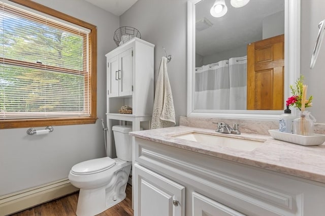 224 Church, Pembroke, NH 03275 - bathroom with baseboard heating, vanity, and wood finished floors