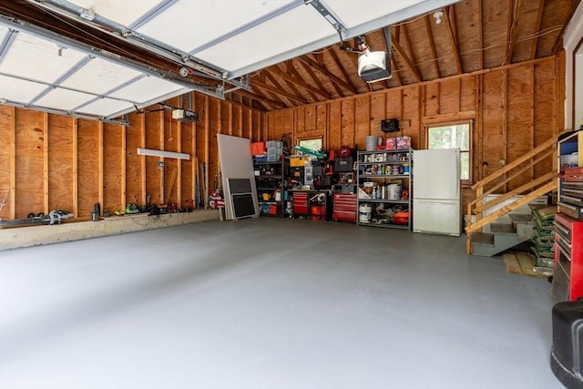 224 Church, Pembroke, NH 03275 - garage with a garage door opener and freestanding refrigerator