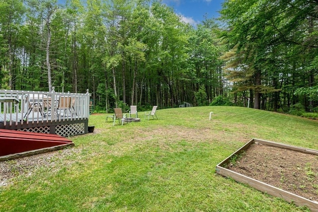 224 Church, Pembroke, NH 03275 - view of grassy yard with a garden and a deck