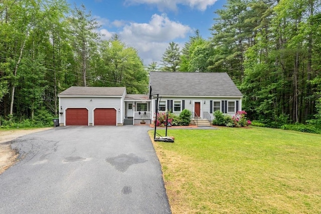 224 Church, Pembroke, NH 03275 - new england style home featuring an attached garage, asphalt driveway, and a front lawn