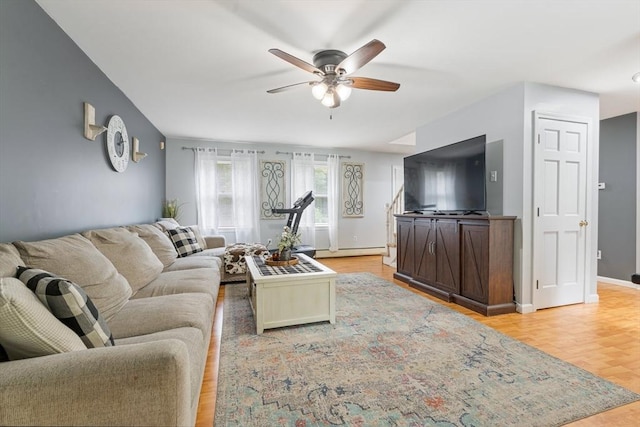 224 Church, Pembroke, NH 03275 - living area featuring ceiling fan, light wood-style flooring, and a baseboard heating unit