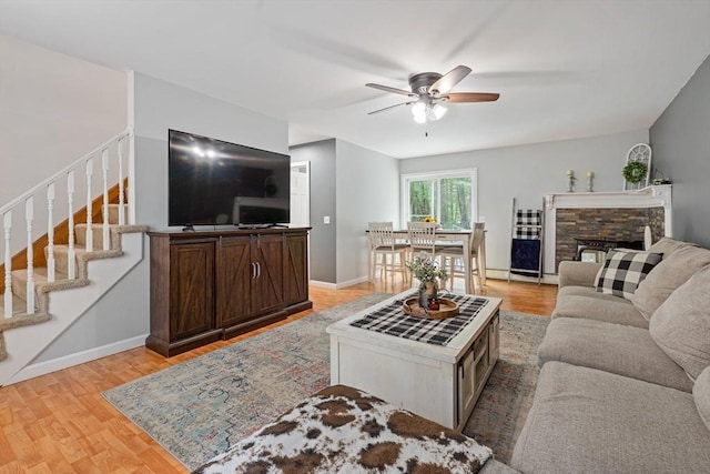 224 Church, Pembroke, NH 03275 - living area featuring ceiling fan, stairway, and light wood finished floors