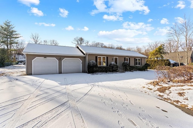 ranch-style home featuring a garage