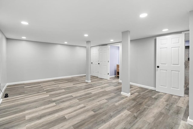 basement featuring light hardwood / wood-style floors