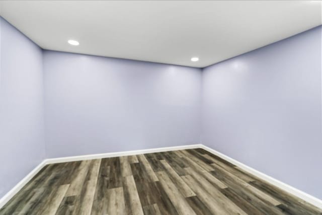 spare room with dark hardwood / wood-style flooring