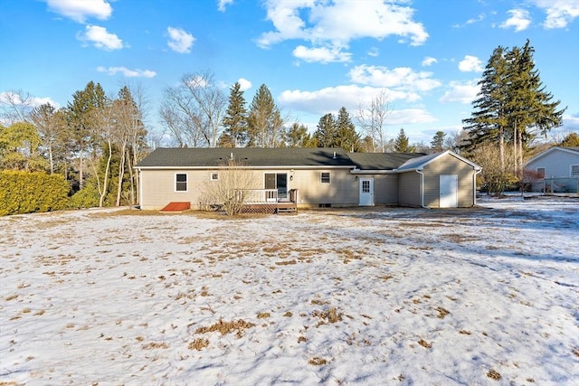 rear view of property with a wooden deck