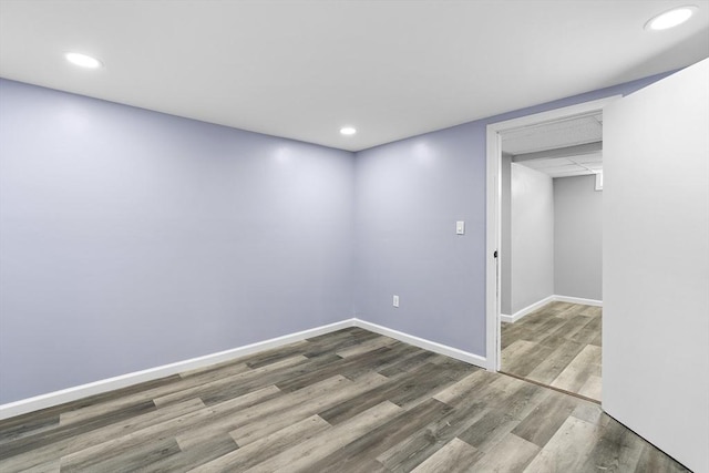 unfurnished room with wood-type flooring