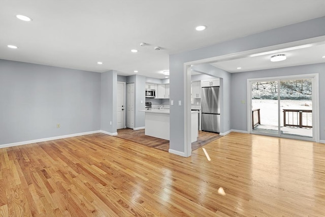 unfurnished living room featuring light hardwood / wood-style flooring