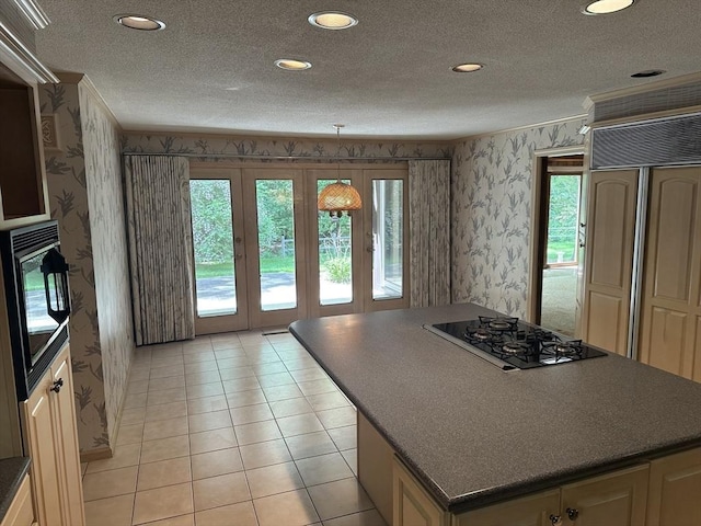 96 Wild Grove Ln, Longmeadow, MA 01106 - kitchen with wallpapered walls, black appliances, dark countertops, a center island, and a textured ceiling
